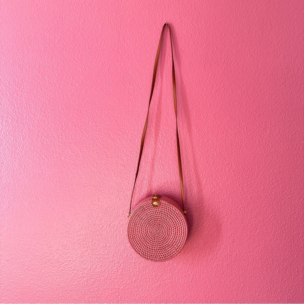 Round Pink Rattan purse.